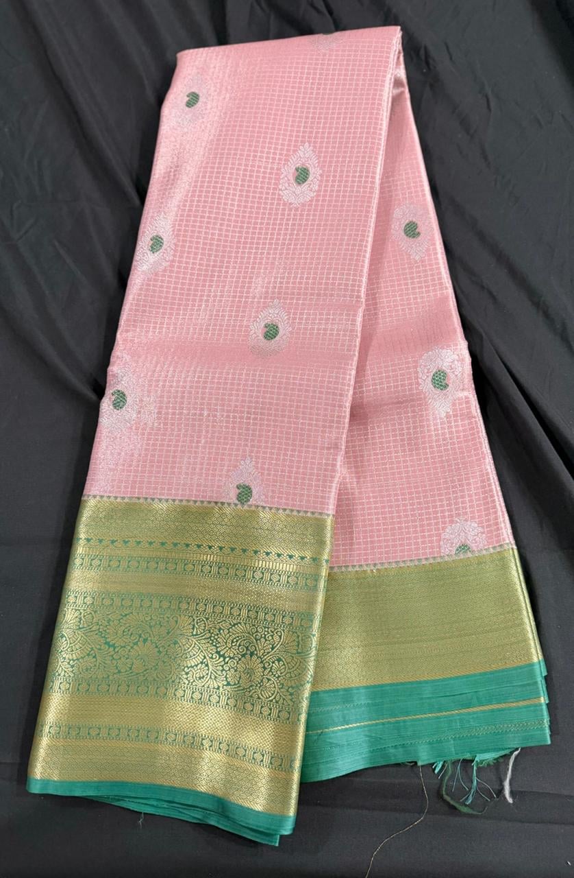 Light pink Kanchipuram silk saree with butta and geometric motifs and ornate gold border, body detail view