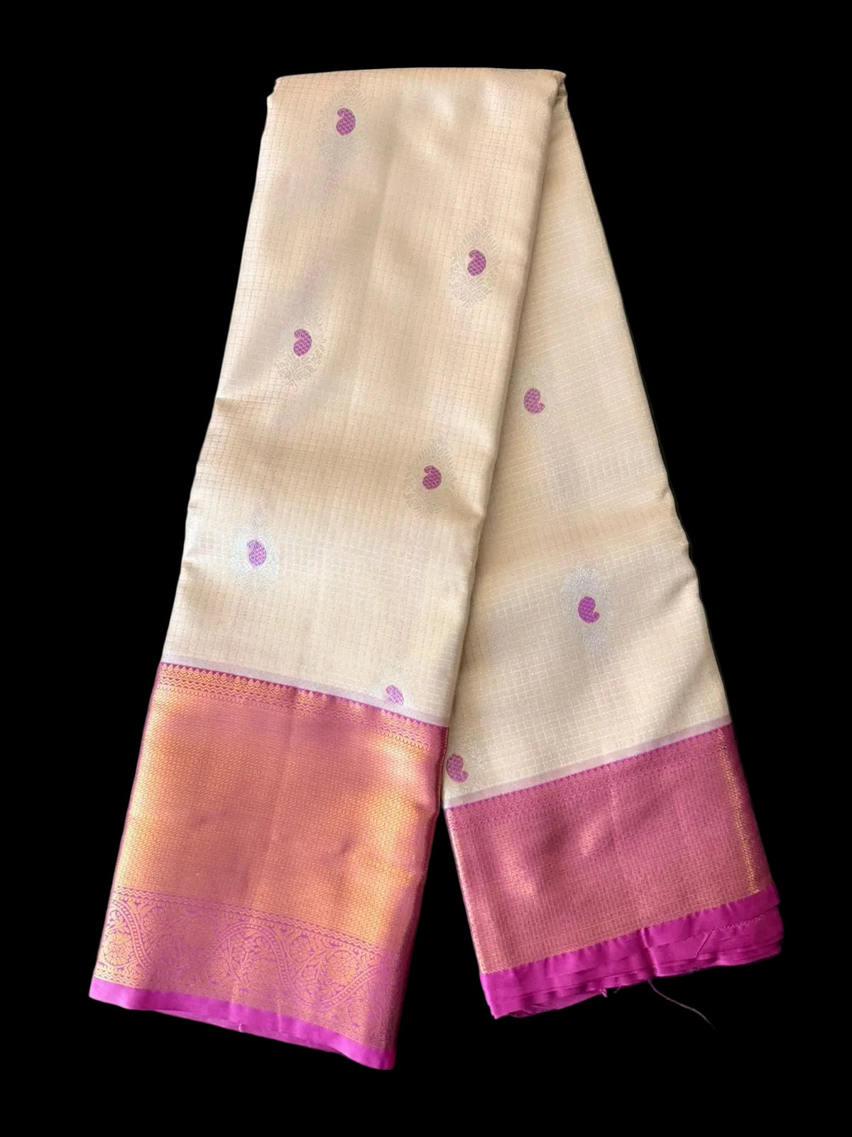 Cream ivory Kanchipuram silk saree with scattered butta motifs and pink-gold woven border, body detail view
