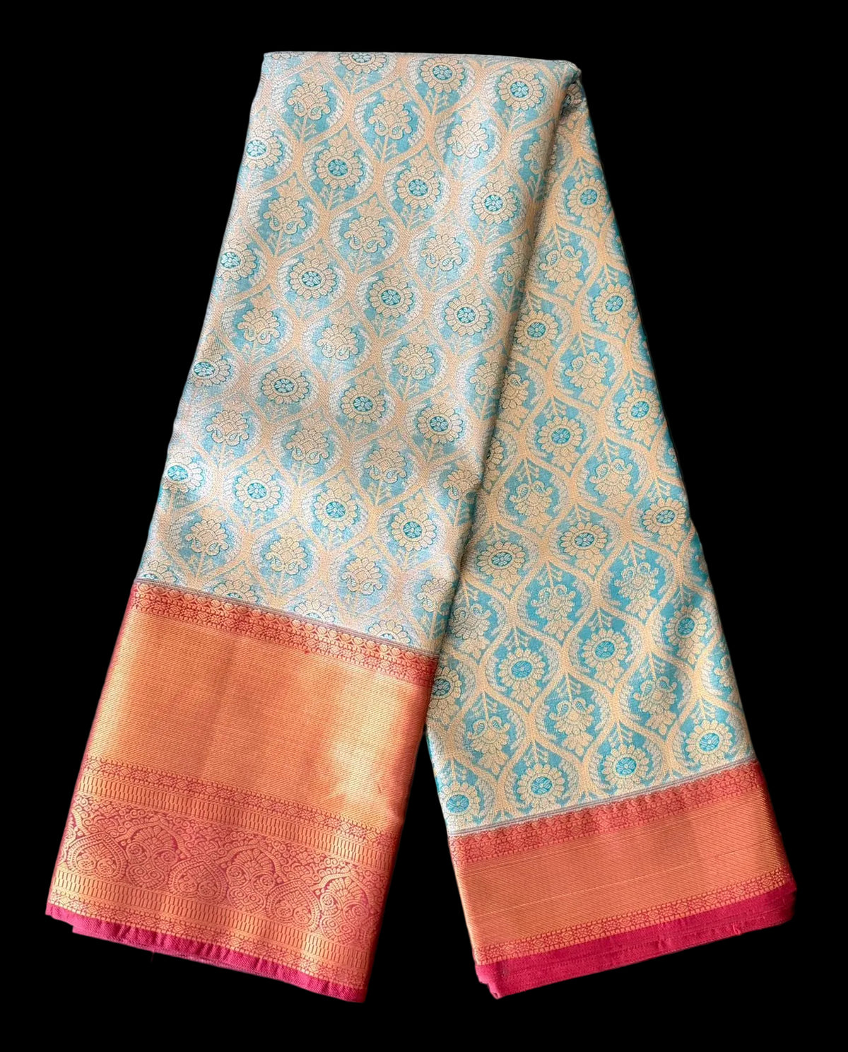 Cream Kanchipuram silk saree with repeating medallion motifs in teal and gold tones, body detail view