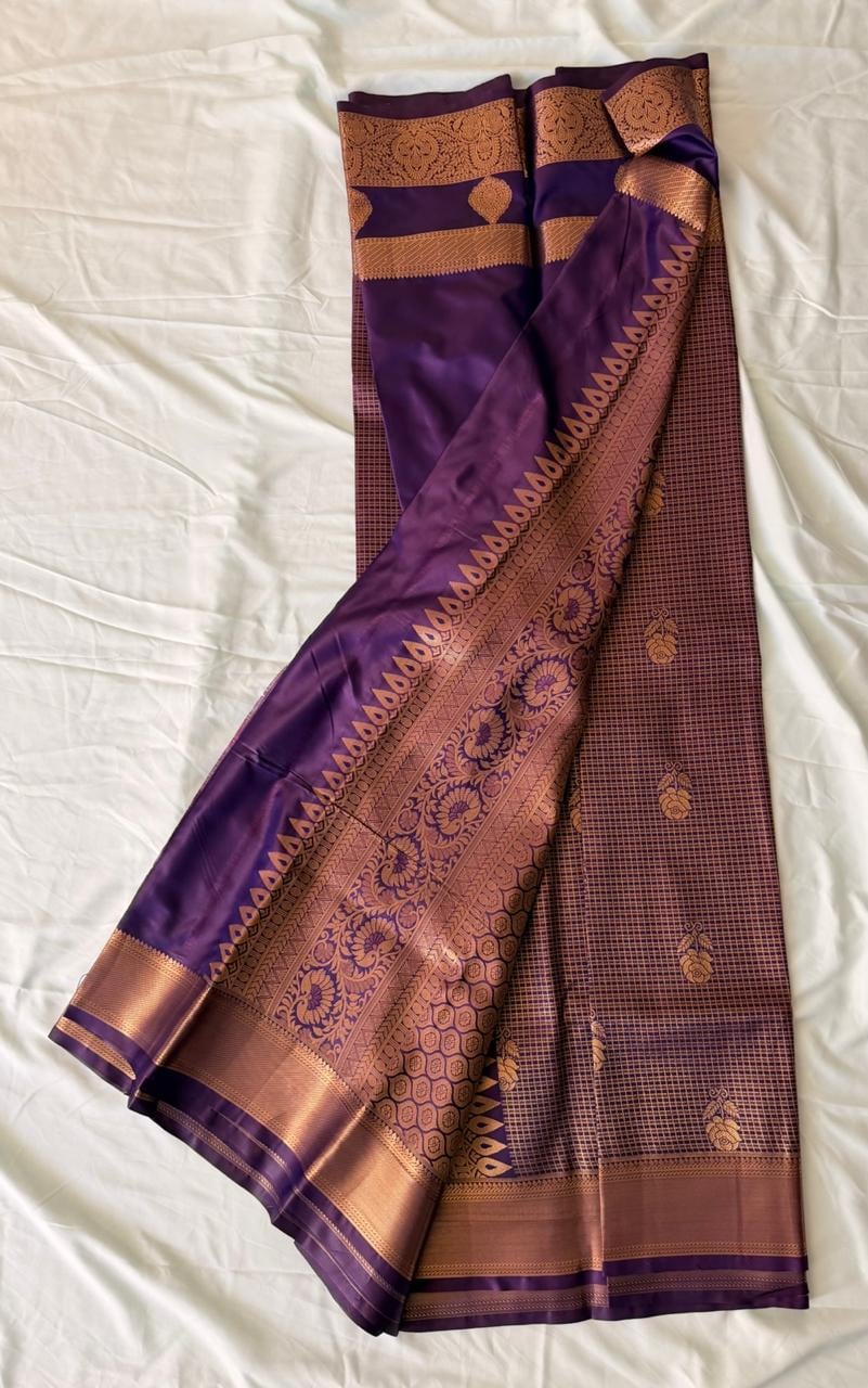 Deep wine purple Kanchipuram silk saree with floral checks, ornate gold border and elaborate paisley pallu, draped product view