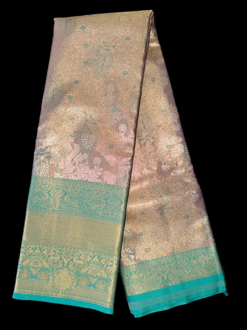 Antique gold Kanchipuram silk saree with ornamental patterning and teal-gold border, detail view