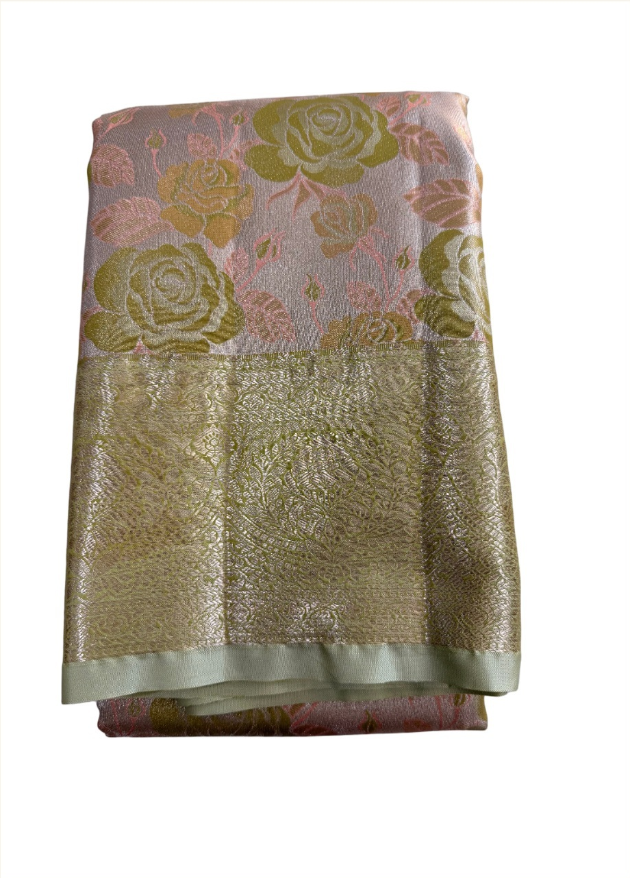 blush-pink floral Semi Kanchivaram saree with olive roses and champagne-gold border, folded detail view