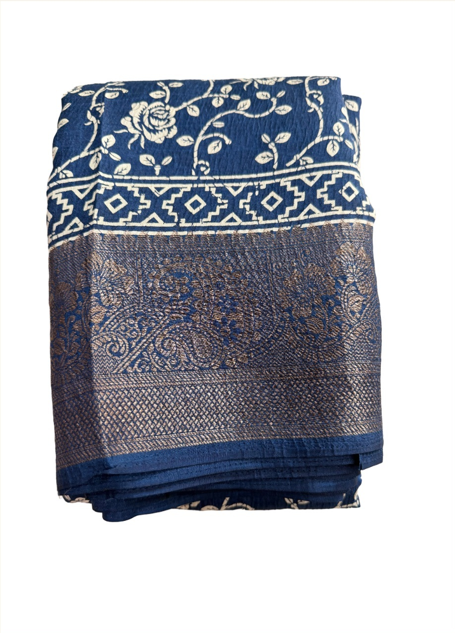 navy-blue floral Semi Kanchivaram saree with ivory vines and antique-gold paisley border, folded detail view