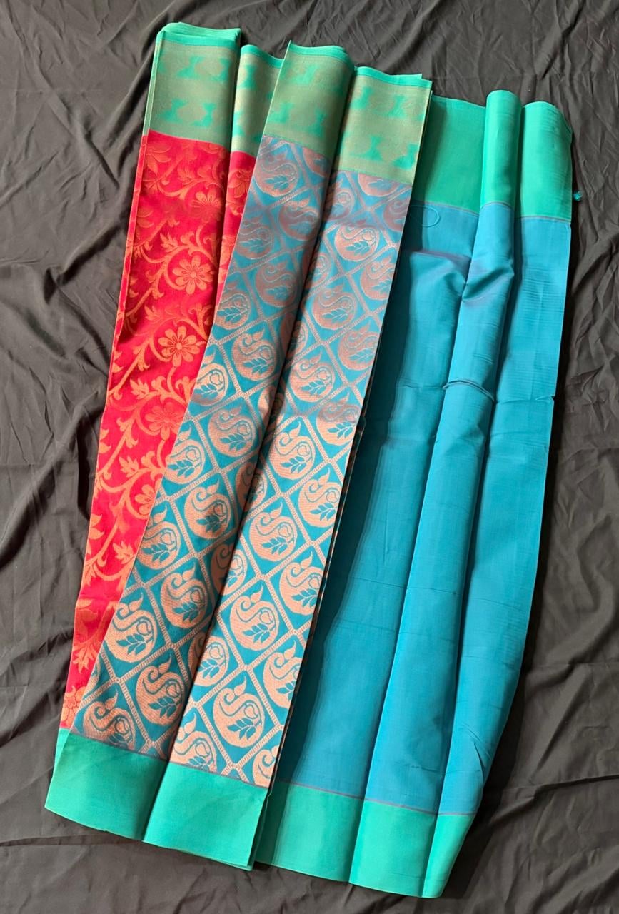 Teal green Organza saree with floral and butta motifs in gold and peacock blue, red-gold border, full product view