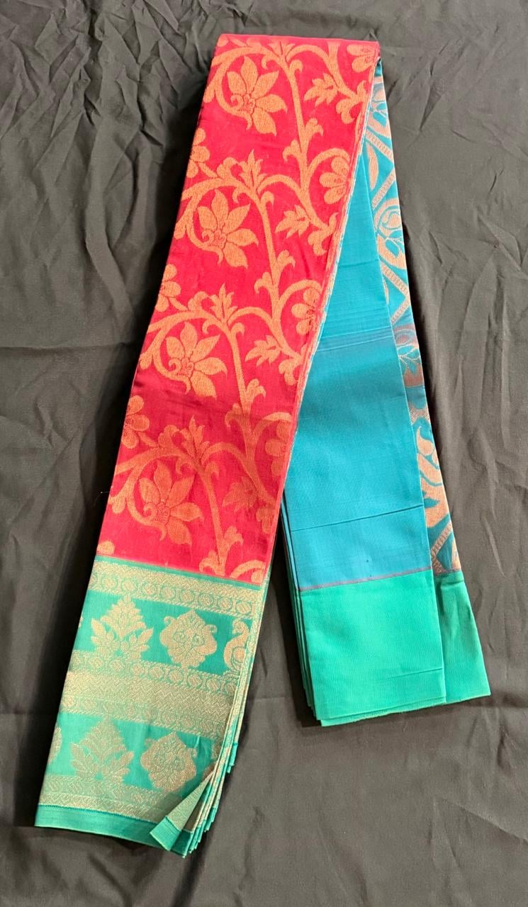 Teal green Organza saree with repeating floral and butta motifs in gold on teal base with peacock blue accents, body detail view