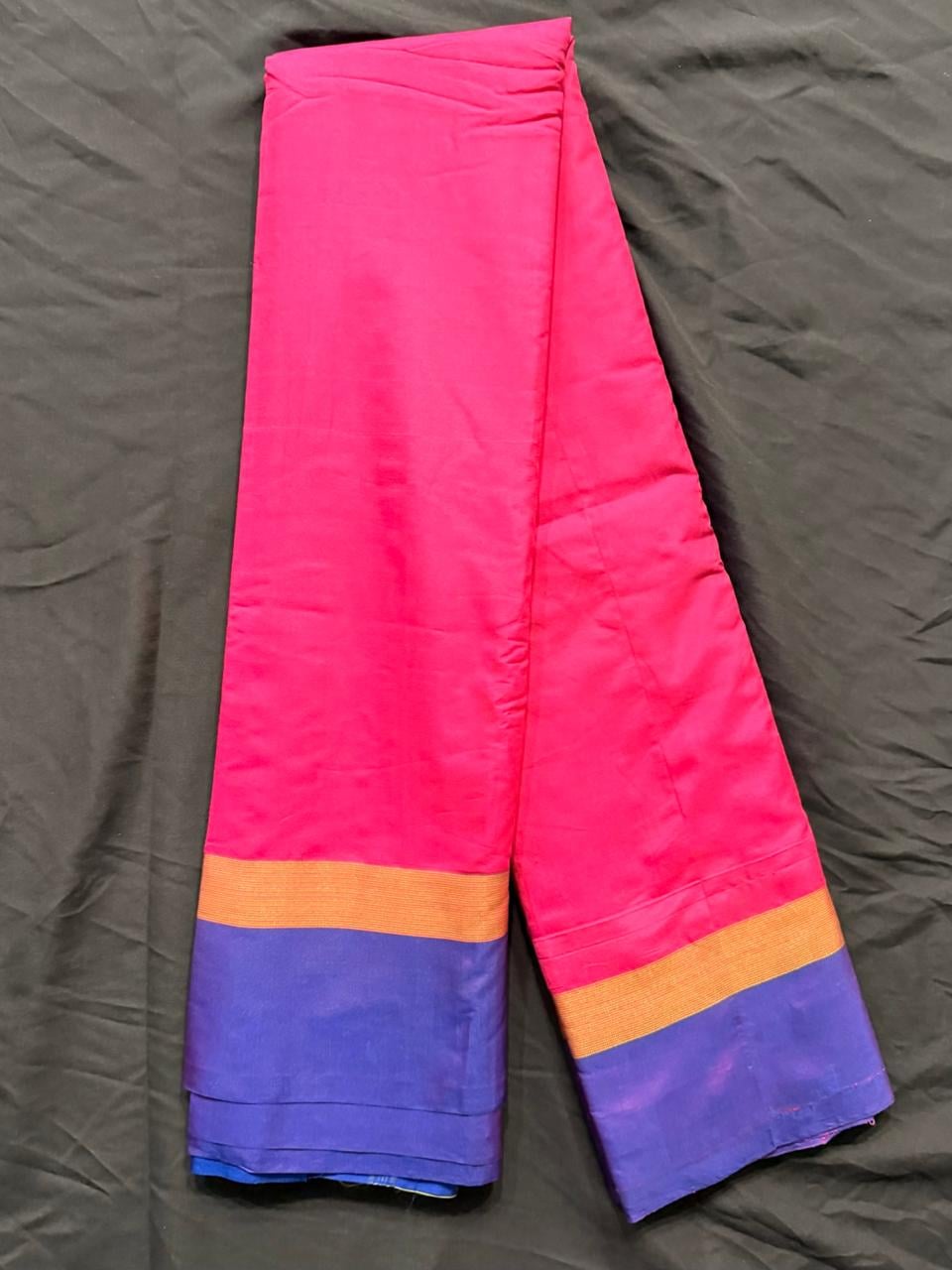 Hot pink color-block saree with royal purple and cobalt blue sections, body detail view