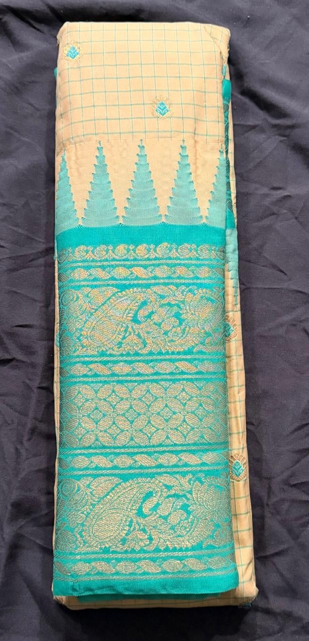 Teal green Kanchipuram silk saree with paisley and temple-like motifs in gold, wide ornate border detail view