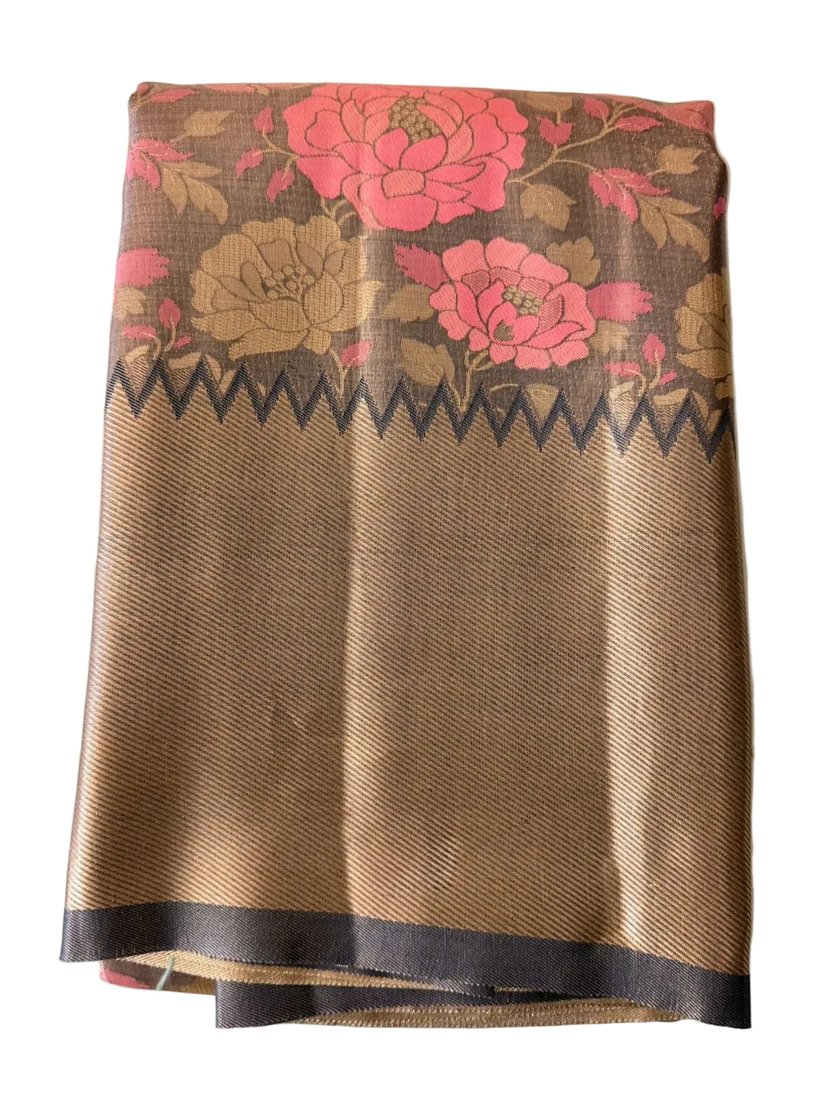 Warm taupe brown Kanchipuram silk saree with floral and geometric motifs, ornate pink-gold border and patterned pallu, folded detail view