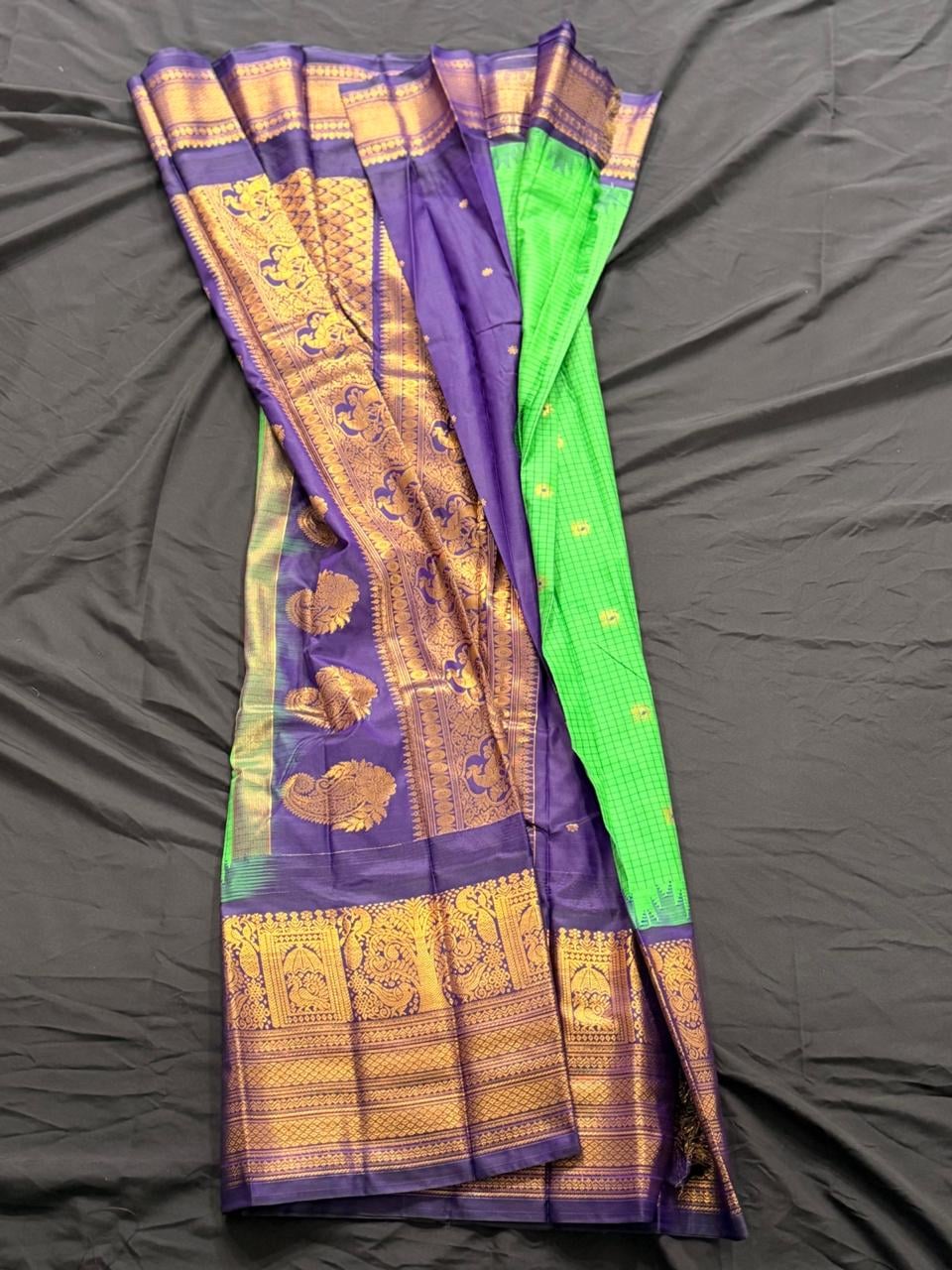 Bright lime green Kanchipuram silk saree with checks, butta, floral and geometric motifs with gold and purple ornate border, draped product view